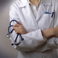 Female Physician folding her arms and holding a stethoscope